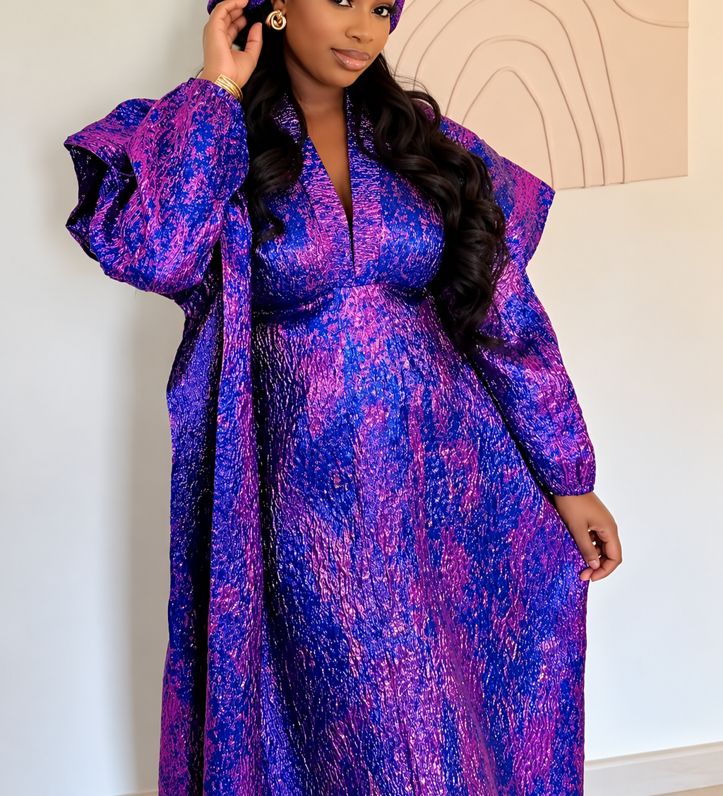 Purple statement sleeve Kaftan dress modelled in an elegant interior