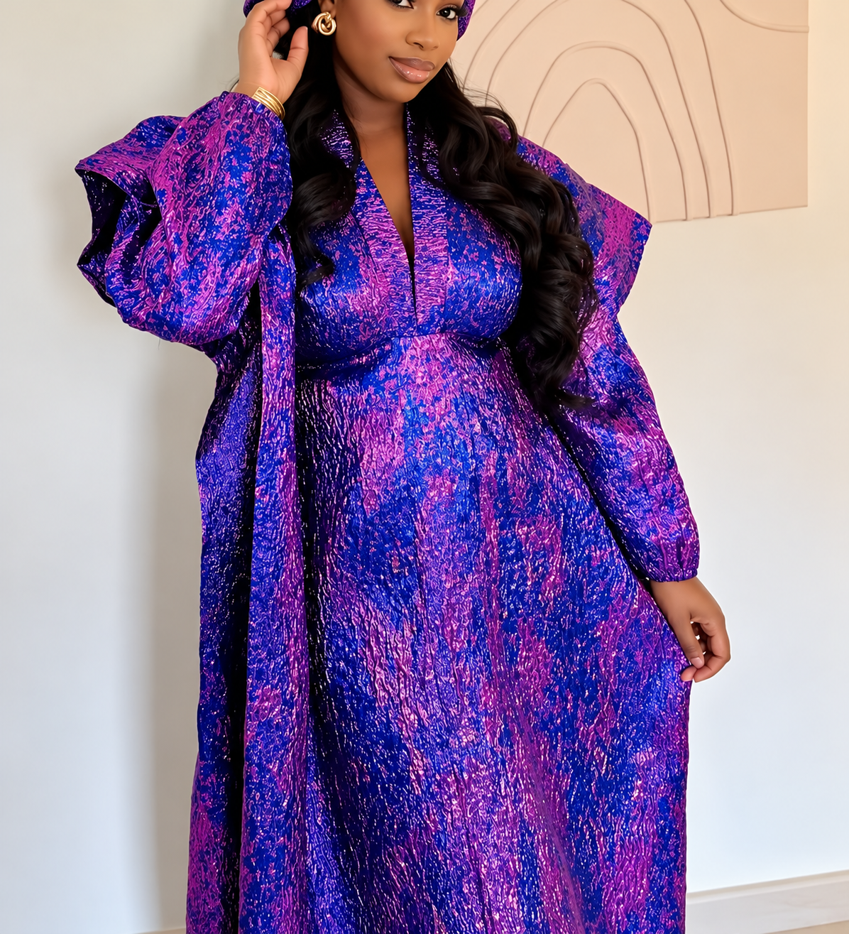 Purple statement sleeve Kaftan dress modelled in an elegant interior