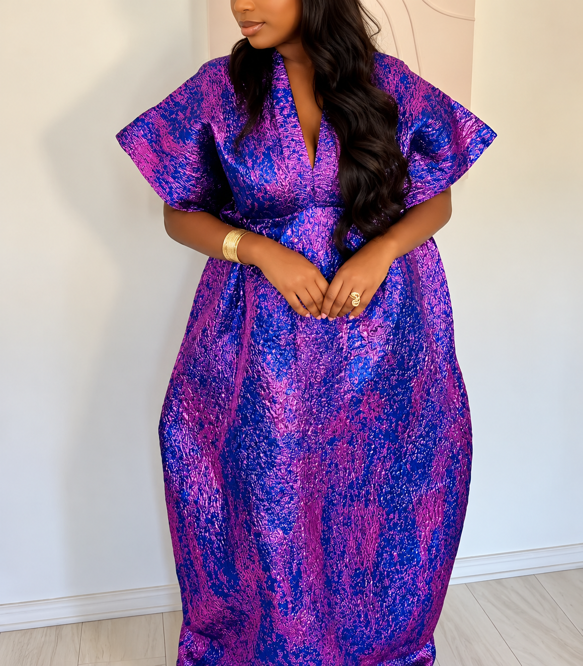 Purple Kaftan dress showing textured fabric and structured shoulders